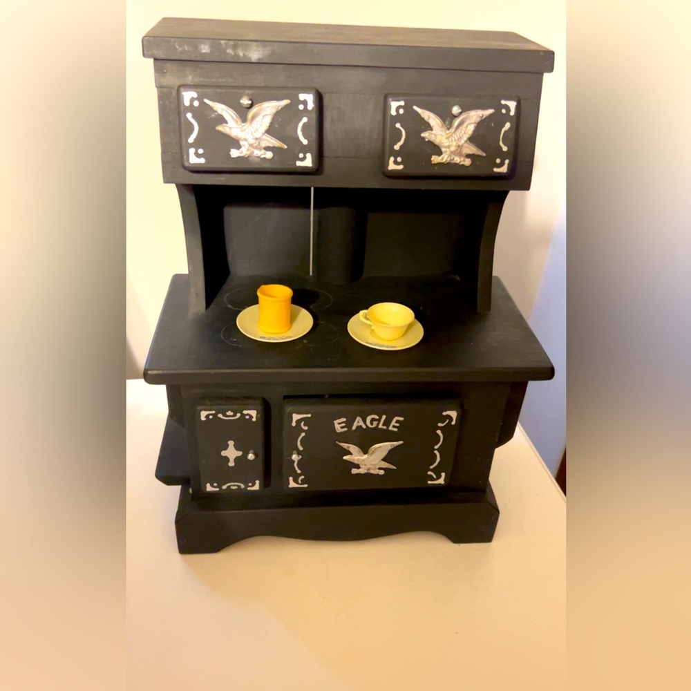 Handmade cute small wooden child’s play kitchen with dishes